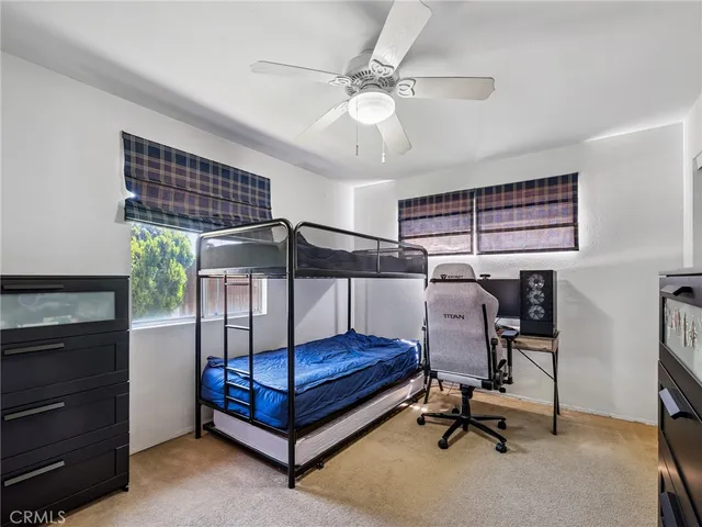 a bedroom with furniture and a window