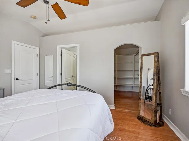 a bedroom with a bed and a closet