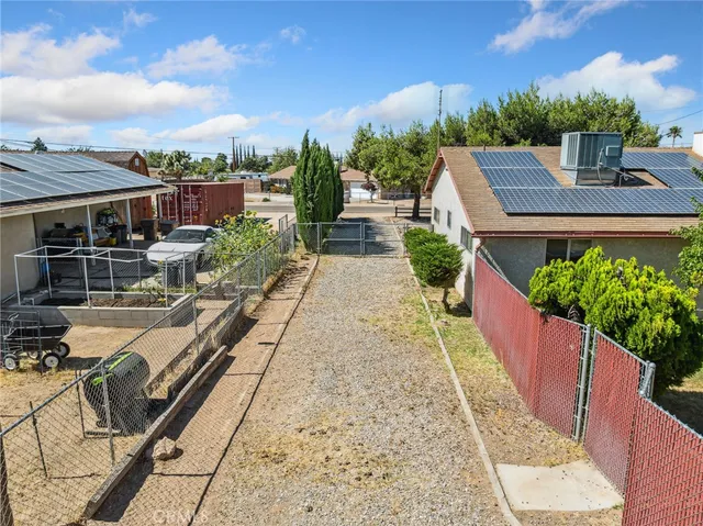 a view of a backyard with sitting area