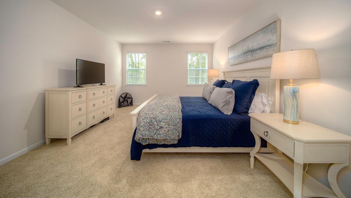 1205 Secrest Cmns Drive Monroe, NC 28112 - Photo 20 of 38 a bedroom with a bed and a flat screen tv