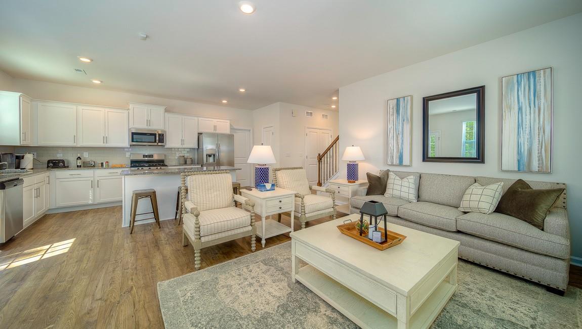 1205 Secrest Cmns Drive Monroe, NC 28112 - Photo 3 of 38 a living room with furniture and a wooden floor