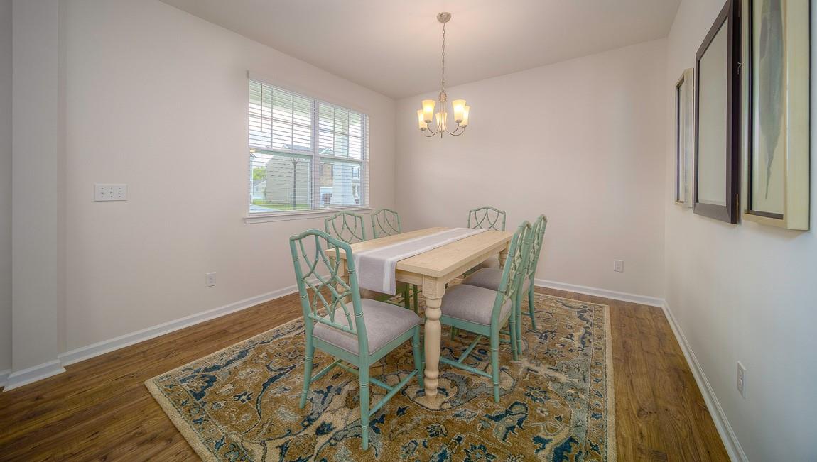 1205 Secrest Cmns Drive Monroe, NC 28112 - Photo 4 of 38 a view of a dining room with furniture window and wooden floor