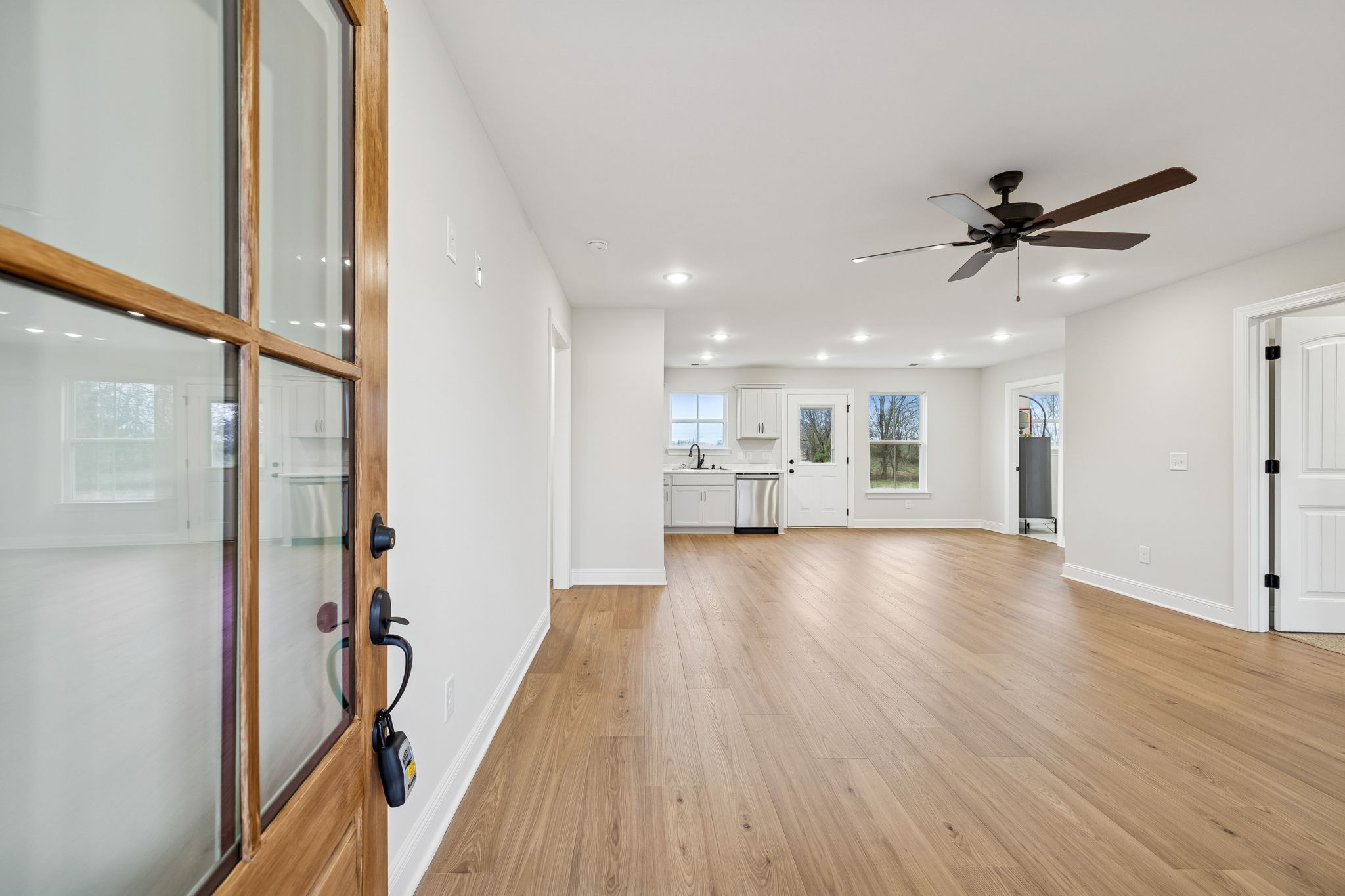 1035 Landing Lane Adams, TN 37010 - Photo 5 of 26 a view of a kitchen with a sink and wooden floor