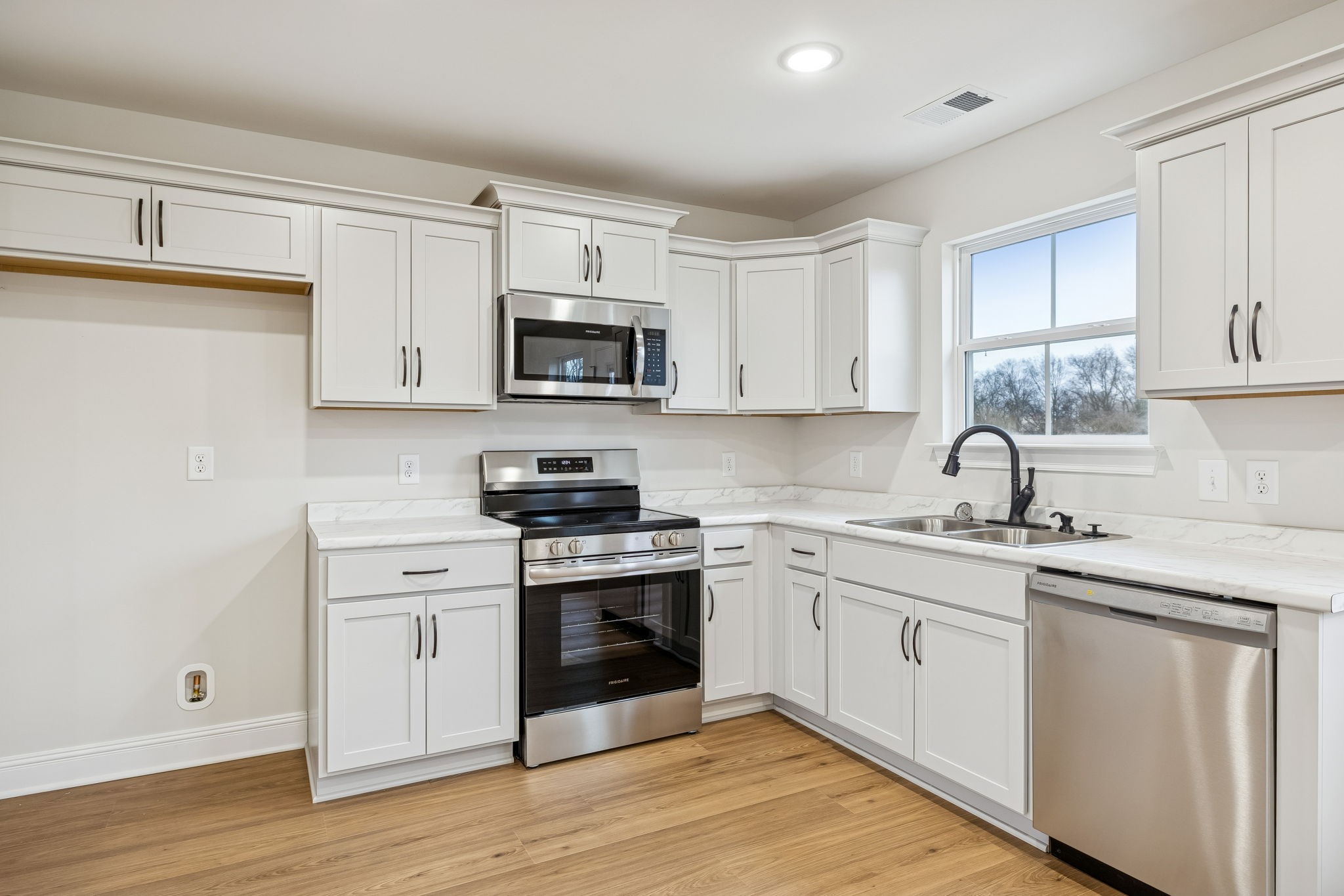 1035 Landing Lane Adams, TN 37010 - Photo 9 of 26 a kitchen with appliances cabinets and a sink