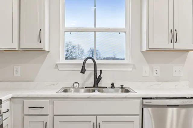a close view of a sink and a window