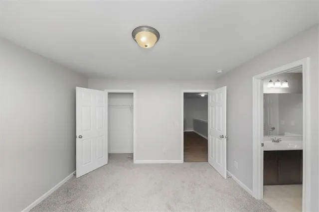 a view of an empty room and closet