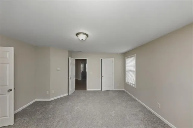 a view of an empty room and window