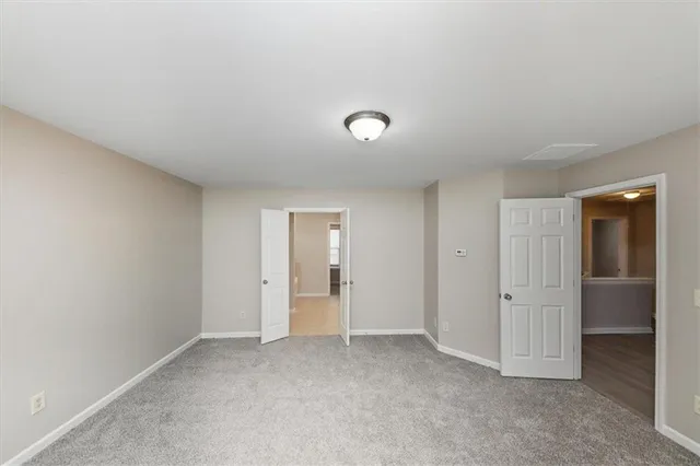 an empty room with closet area