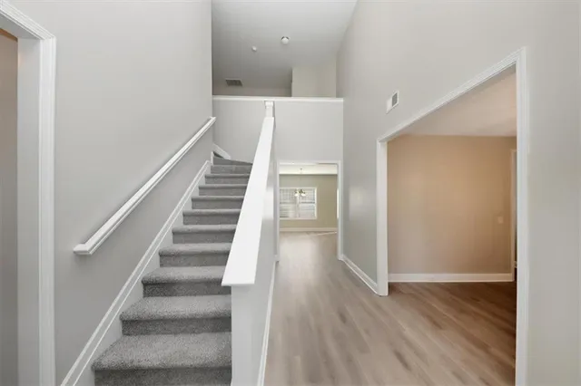a view of an entryway with wooden floor