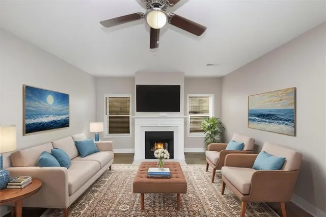 a living room with furniture fireplace and a flat screen tv