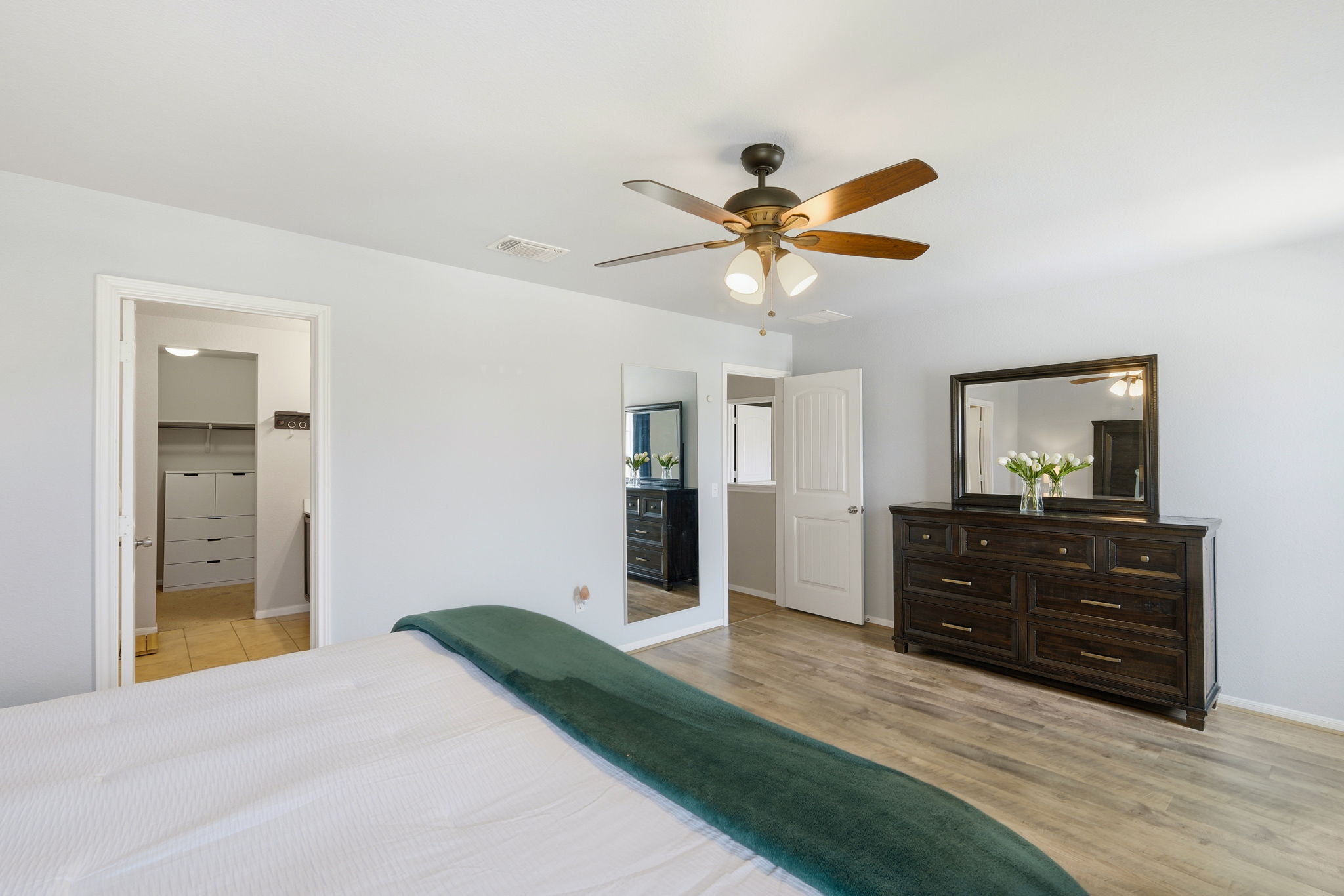1702 Atlas Road Cedar Park, TX 78613 - Photo 18 of 31 Bedroom featuring a ceiling fan and light wood-style flooring