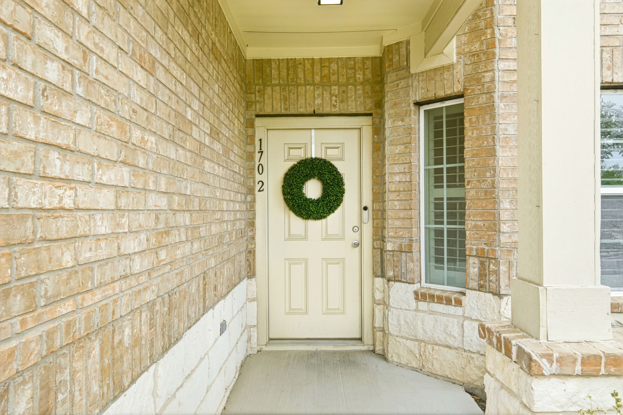 1702 Atlas Road Cedar Park, TX 78613 - Photo 4 of 31 Doorway to property with brick siding