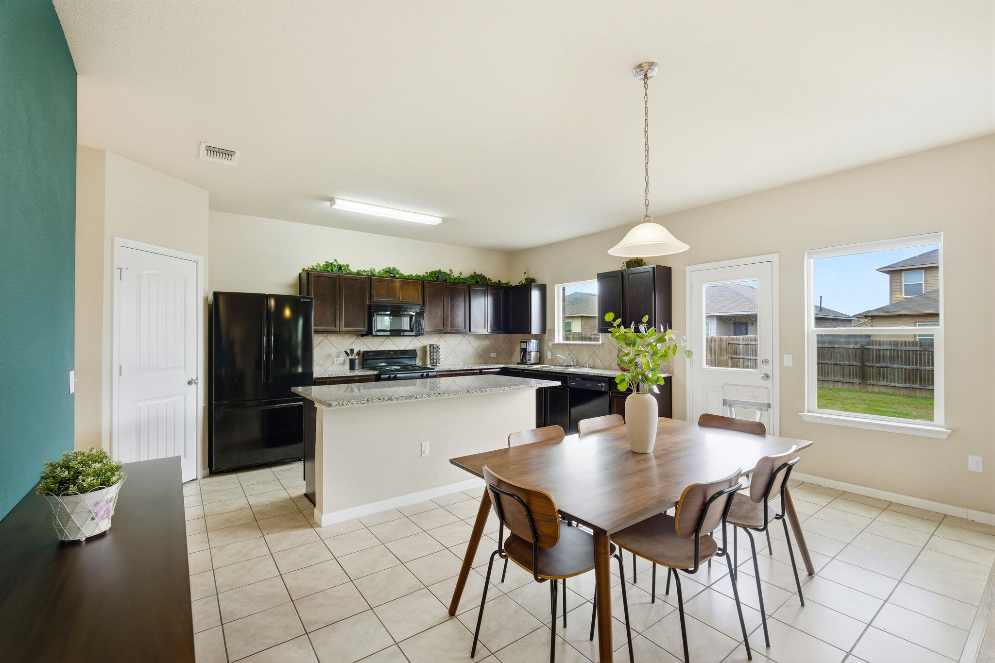 1702 Atlas Road Cedar Park, TX 78613 - Photo 8 of 31 Dining area with light tile patterned floors and baseboards