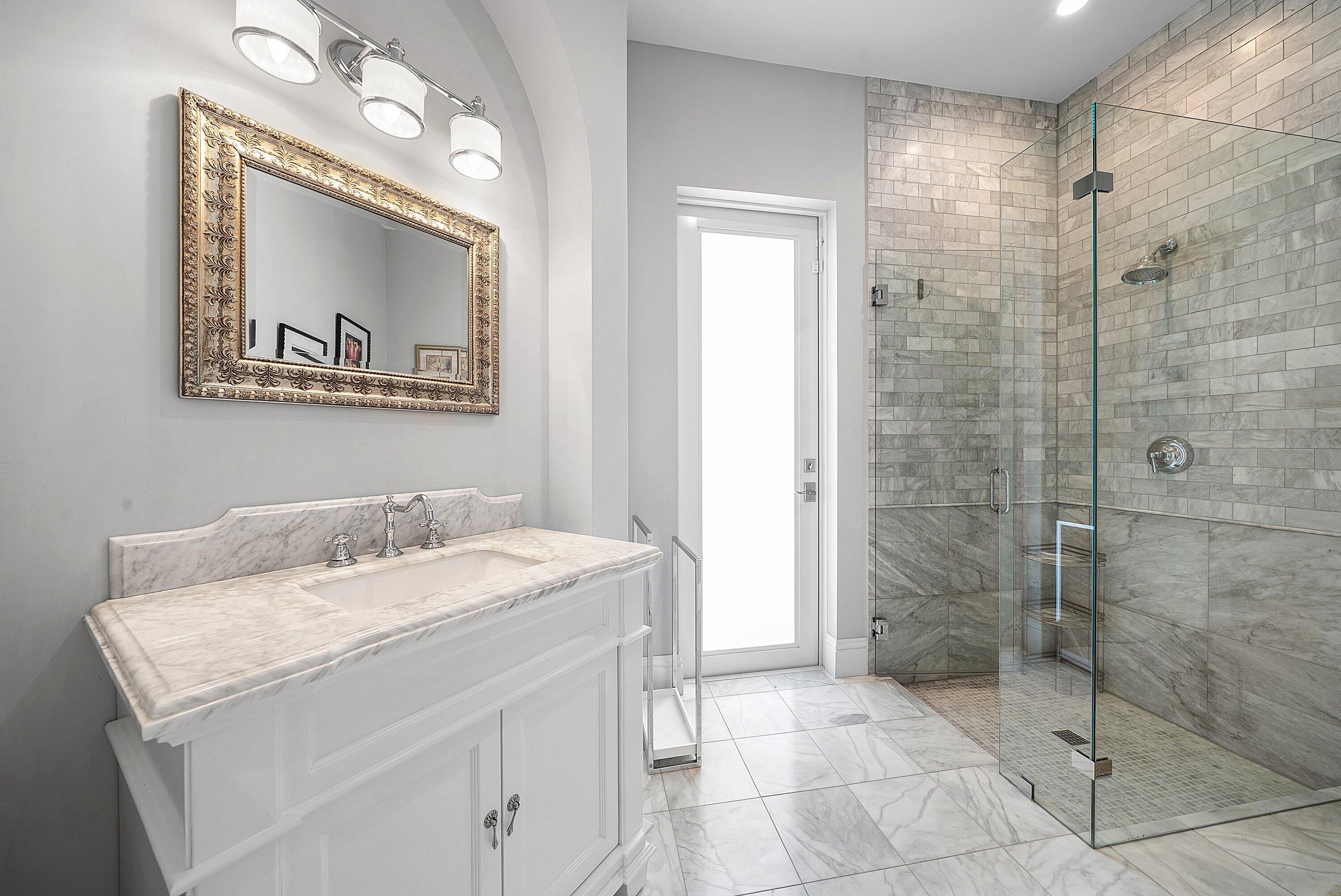 4600 Bocaire Boulevard Boca Raton, FL 33487 - Photo 26 of 98 a bathroom with a granite countertop sink a mirror and a shower