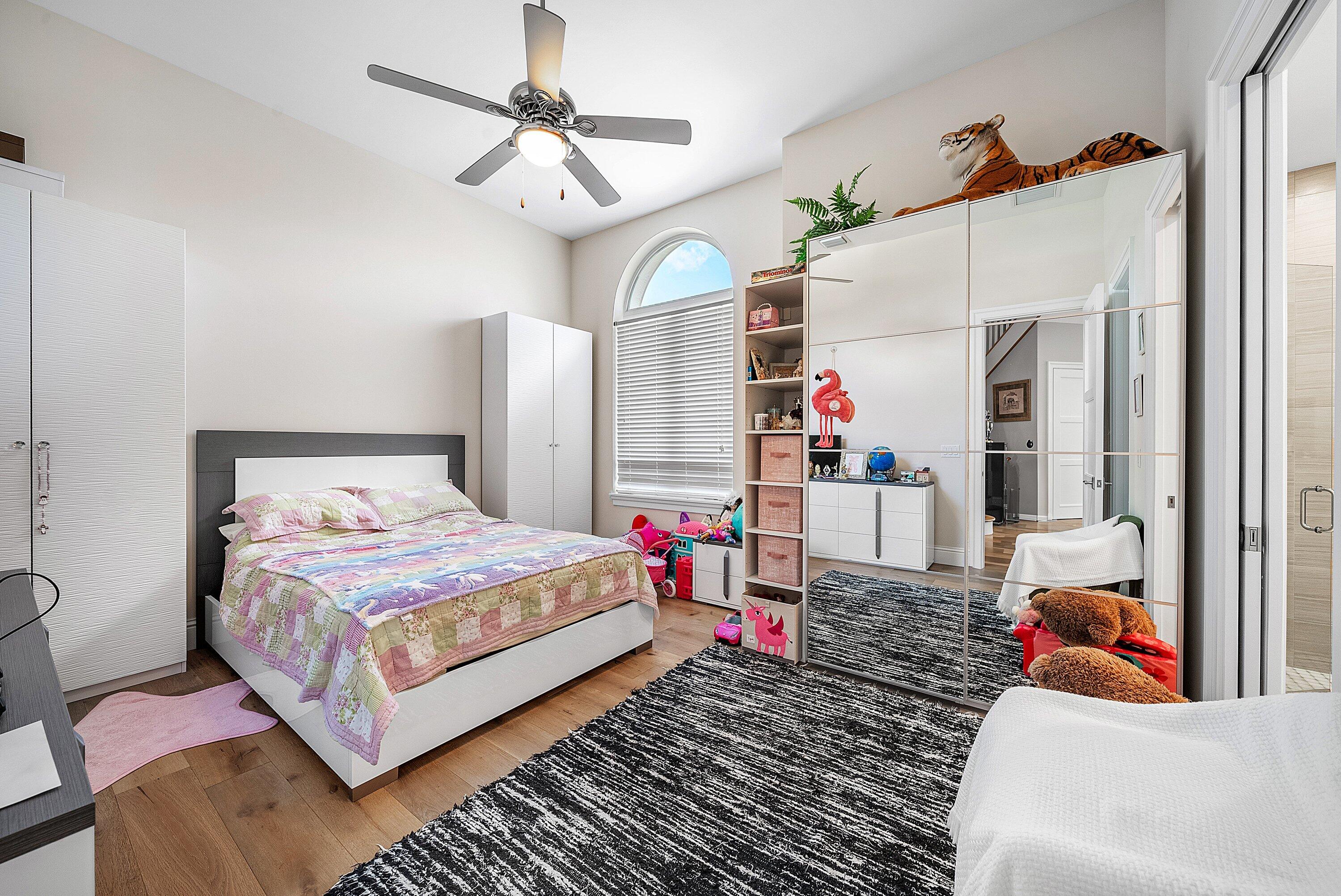 4600 Bocaire Boulevard Boca Raton, FL 33487 - Photo 38 of 98 a bedroom with a bed chandelier and a window