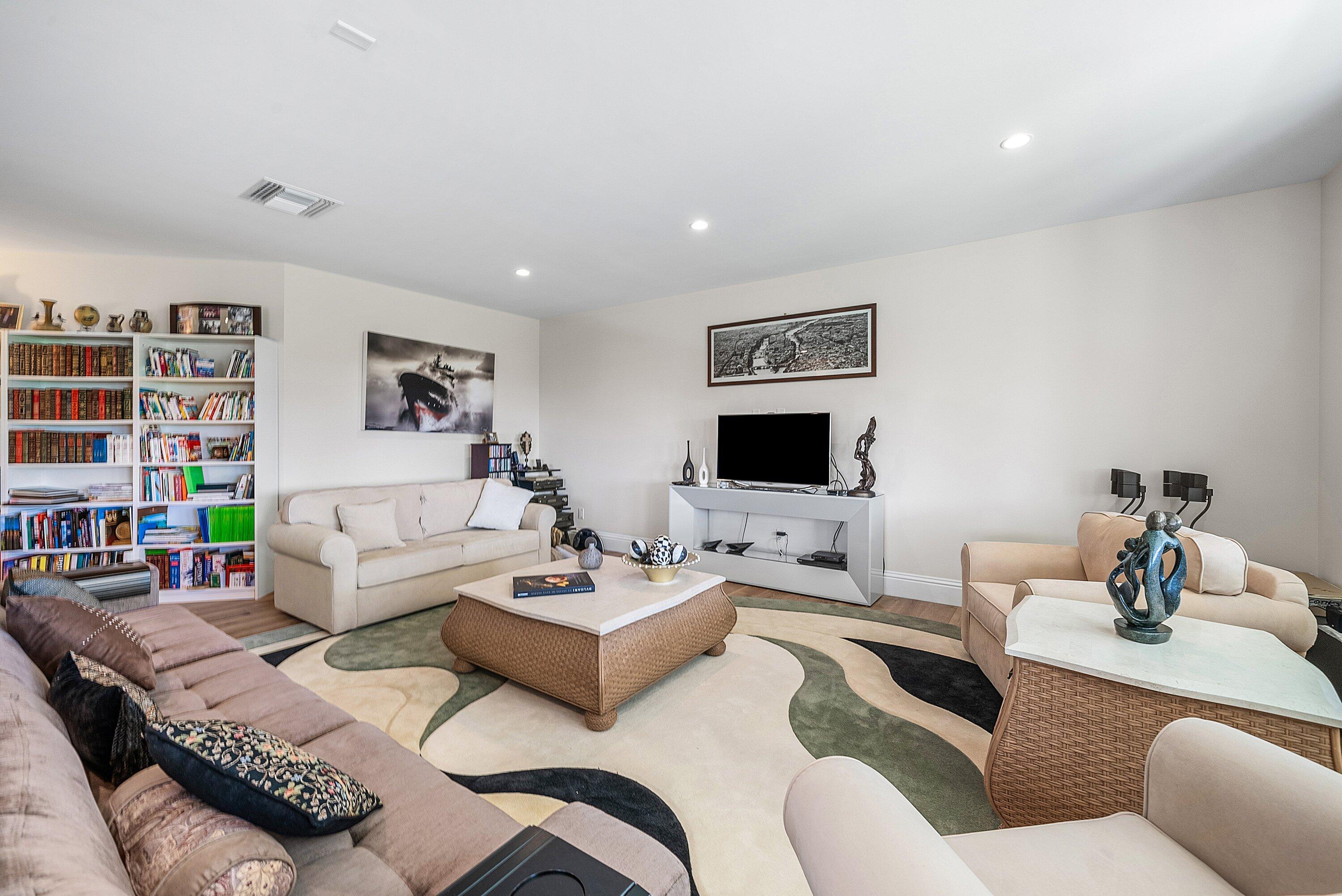 4600 Bocaire Boulevard Boca Raton, FL 33487 - Photo 60 of 98 a living room with furniture and a flat screen tv