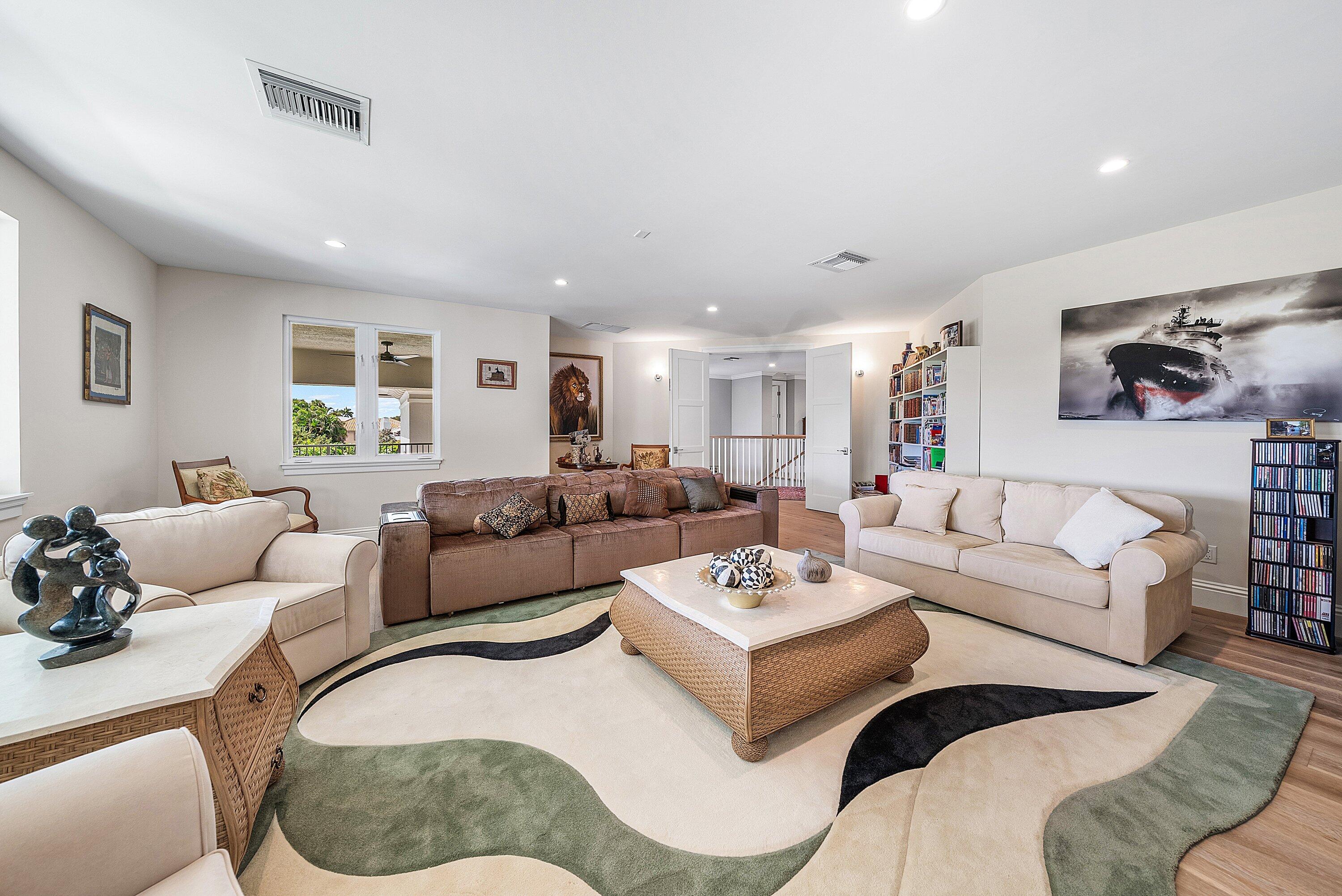4600 Bocaire Boulevard Boca Raton, FL 33487 - Photo 61 of 98 a living room with furniture a couch and kitchen view