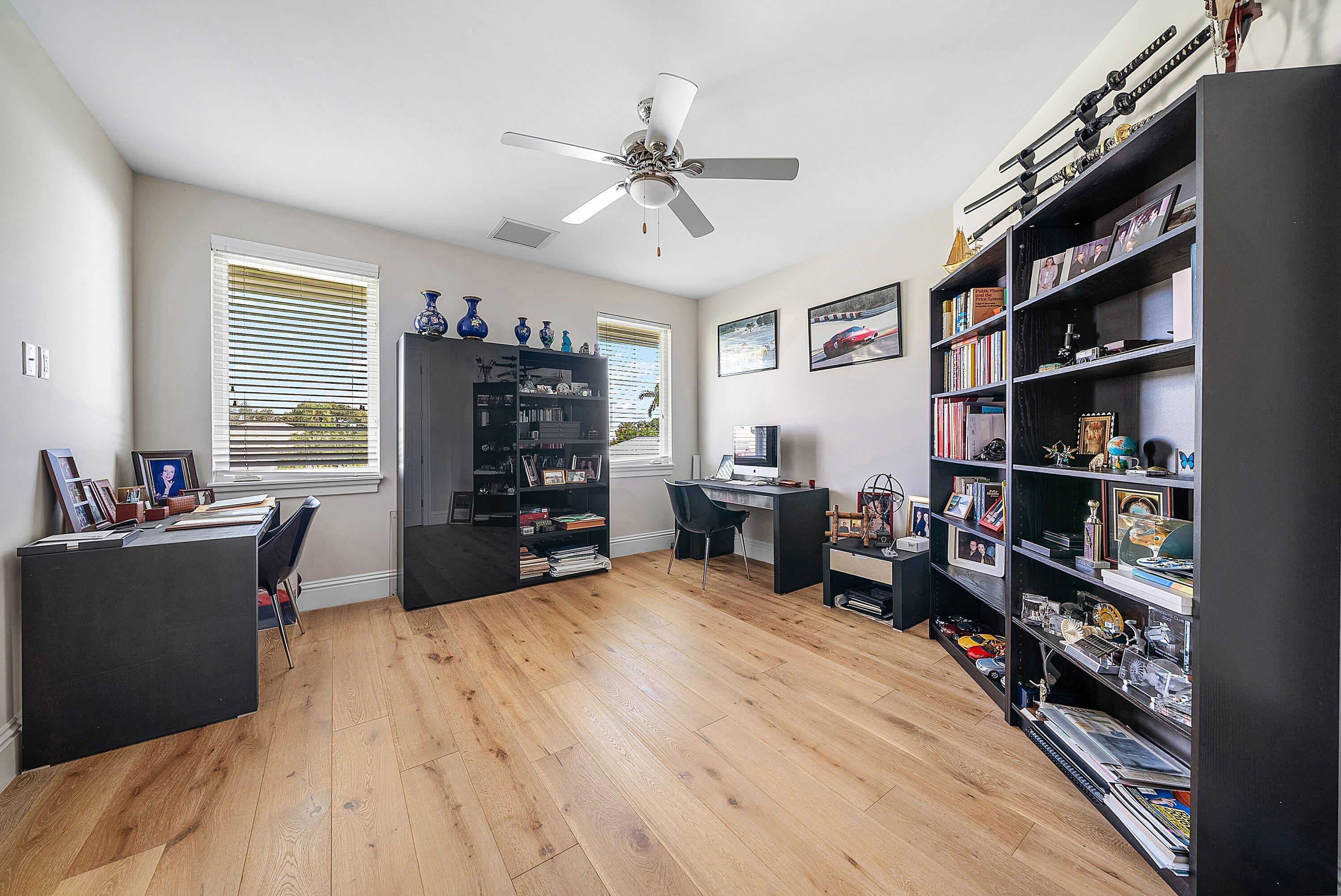 4600 Bocaire Boulevard Boca Raton, FL 33487 - Photo 62 of 98 a bed room with a bed and a book shelf