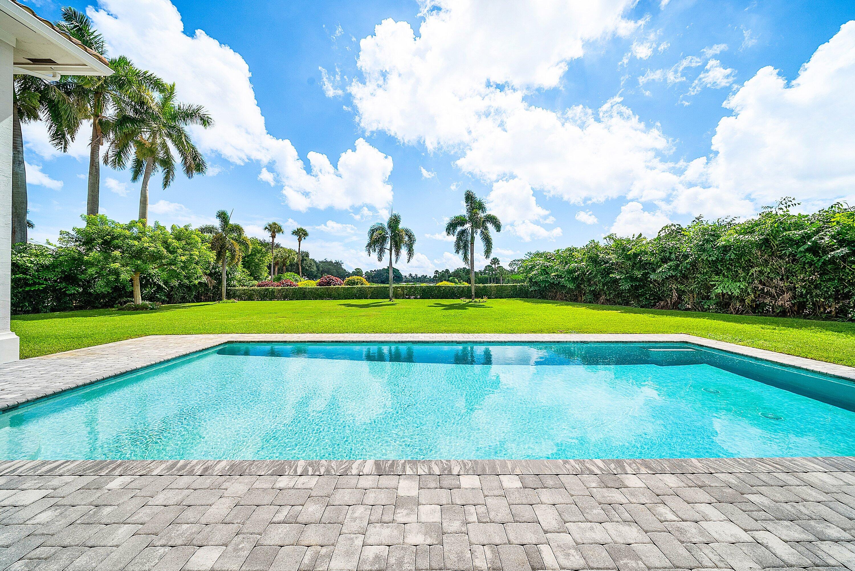 4600 Bocaire Boulevard Boca Raton, FL 33487 - Photo 68 of 98 a view of a swimming pool and a yard