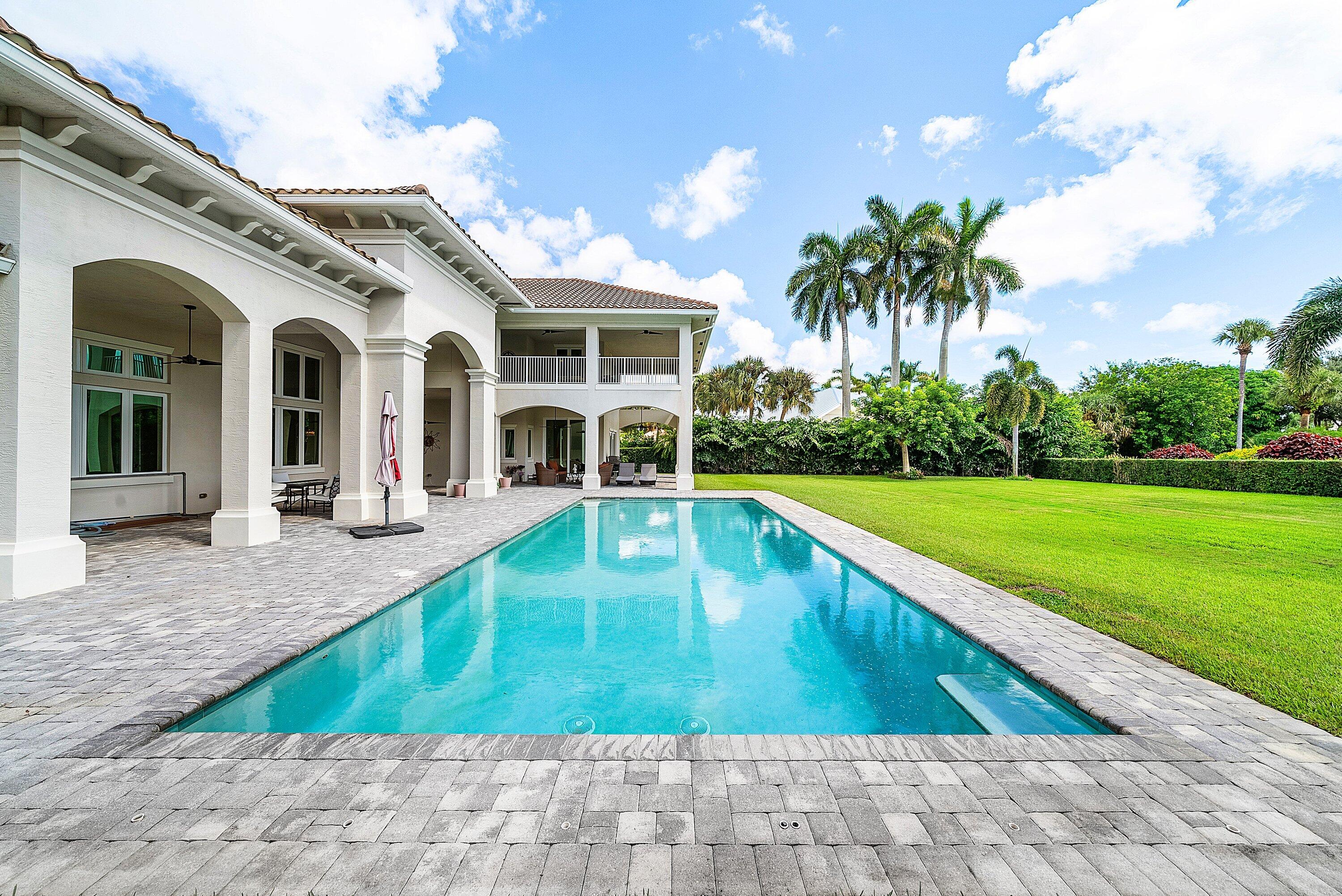 4600 Bocaire Boulevard Boca Raton, FL 33487 - Photo 69 of 98 a view of a house with swimming pool and a yard