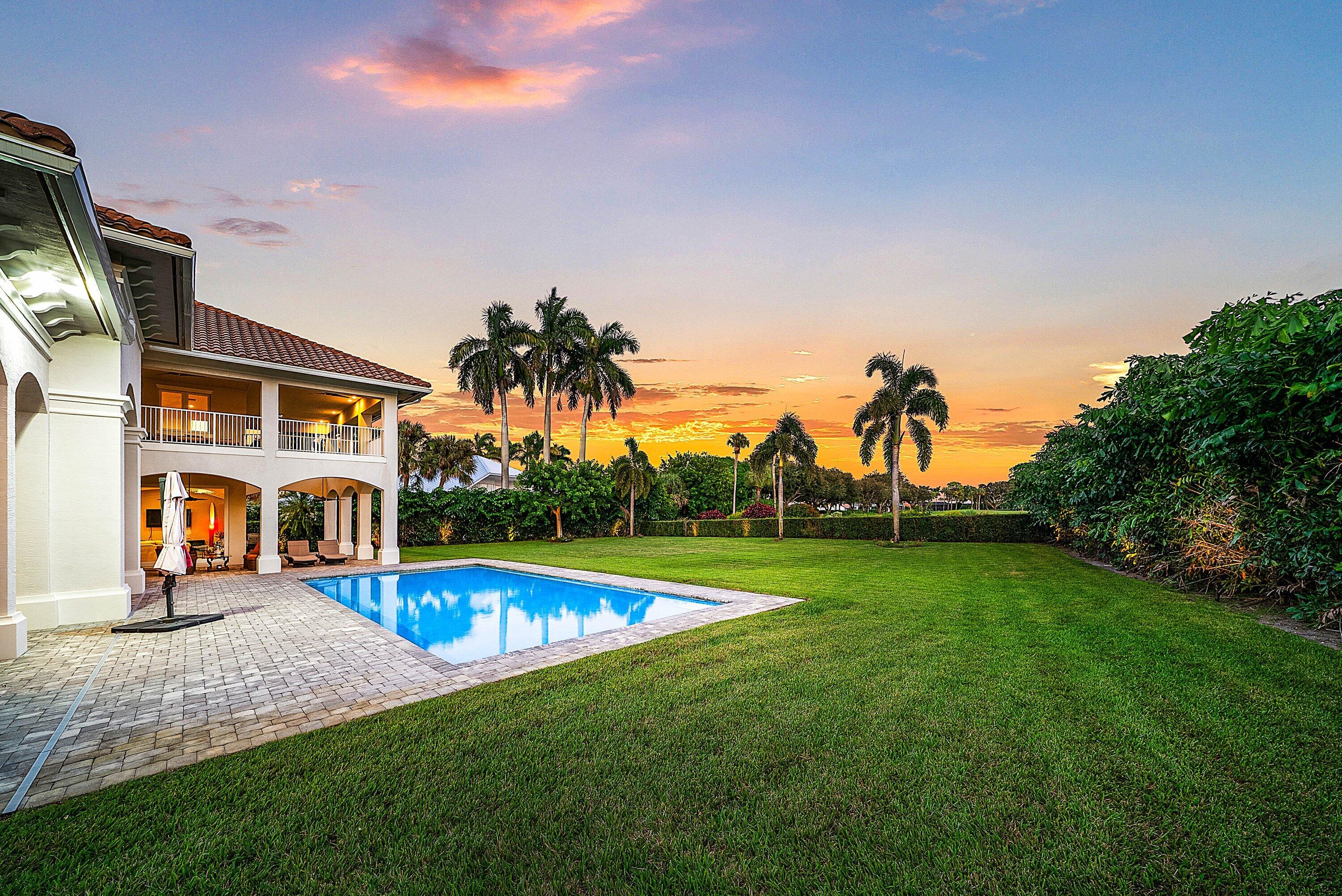 4600 Bocaire Boulevard Boca Raton, FL 33487 - Photo 77 of 98 a view of a house with a swimming pool and a yard