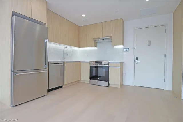 a view of an empty room with a window