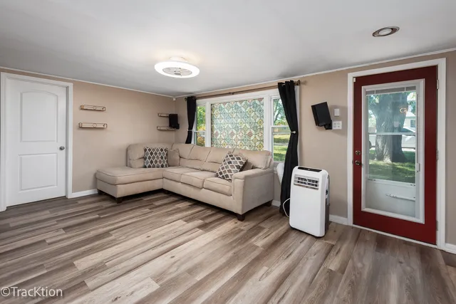 a living room with furniture and a large window