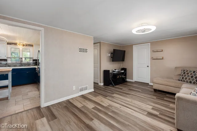 a view of a livingroom with a hall and a stove