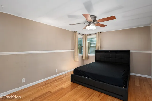 a living room with furniture and a ceiling fan