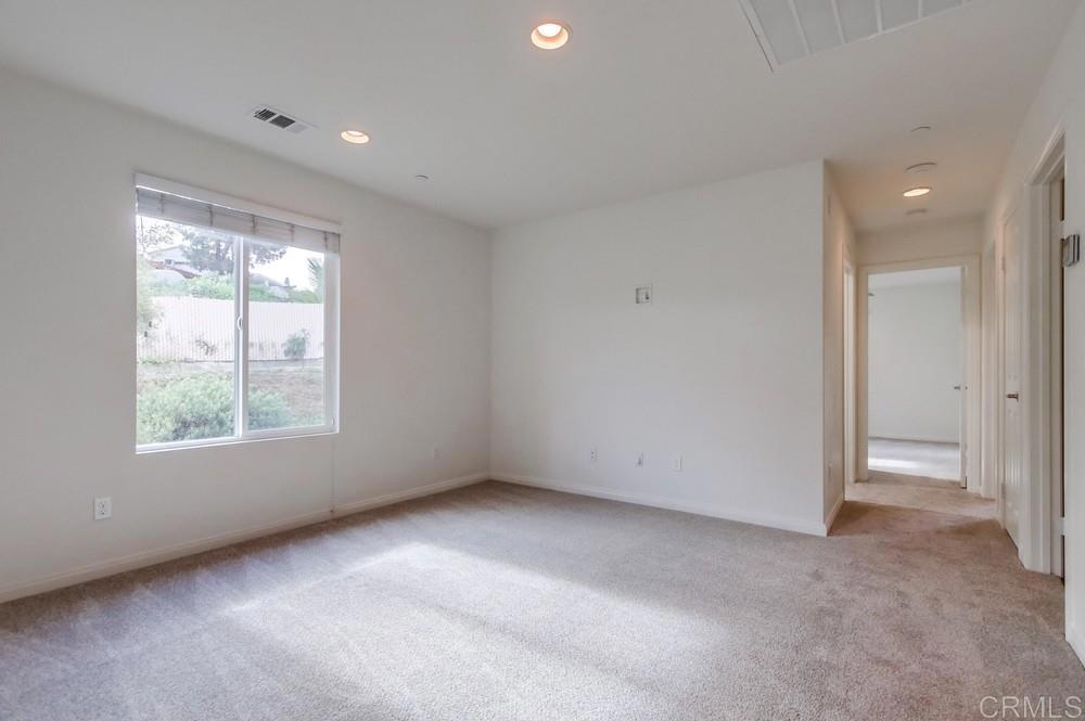 13109 Beacon View Lane El Cajon, CA 92021 - Photo 12 of 36 a view of an empty room with a window