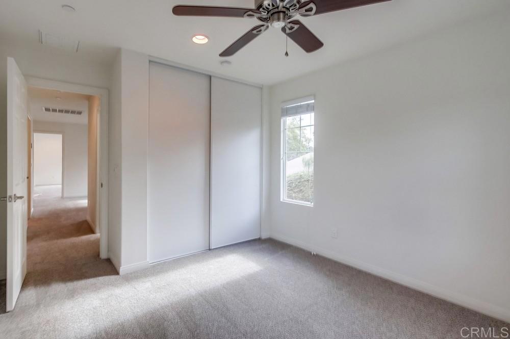 13109 Beacon View Lane El Cajon, CA 92021 - Photo 17 of 36 a view of room with a ceiling fan and window