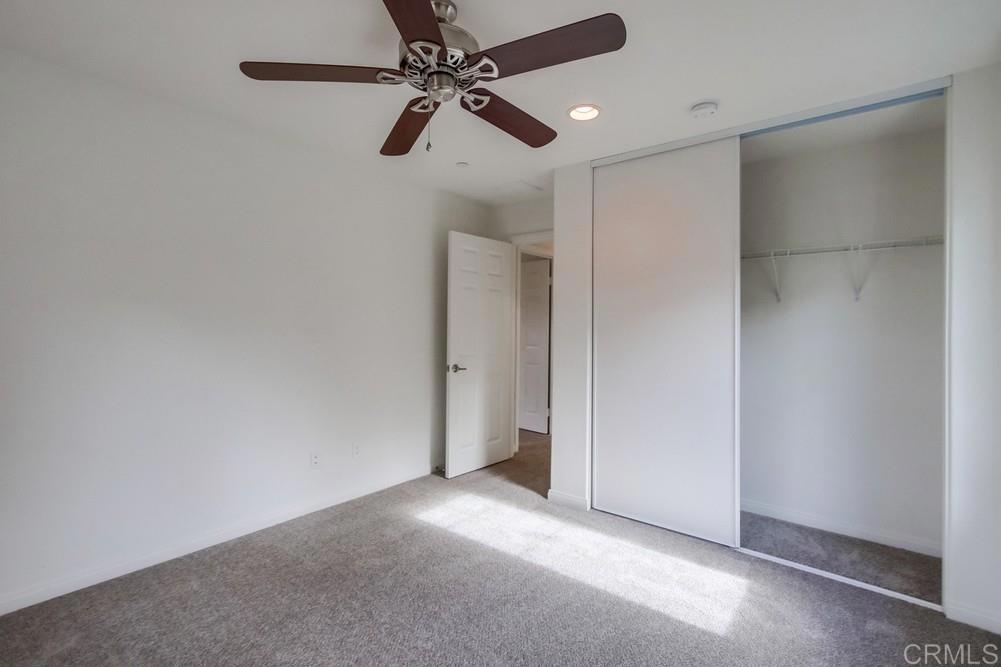 13109 Beacon View Lane El Cajon, CA 92021 - Photo 18 of 36 an empty room with closet and fan