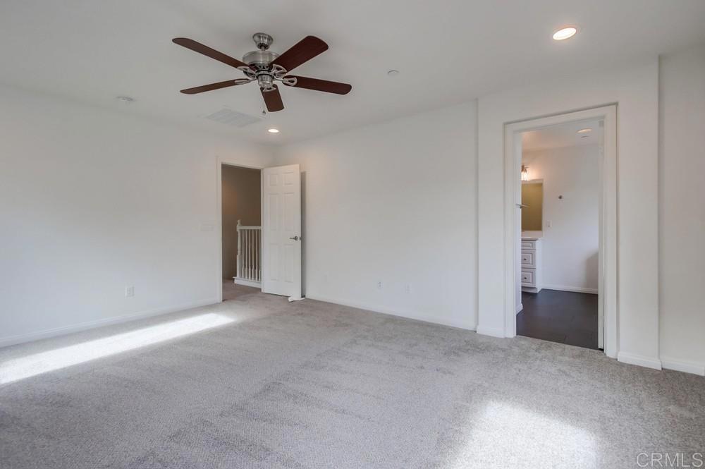 13109 Beacon View Lane El Cajon, CA 92021 - Photo 22 of 36 an empty room and closet and a ceiling fan