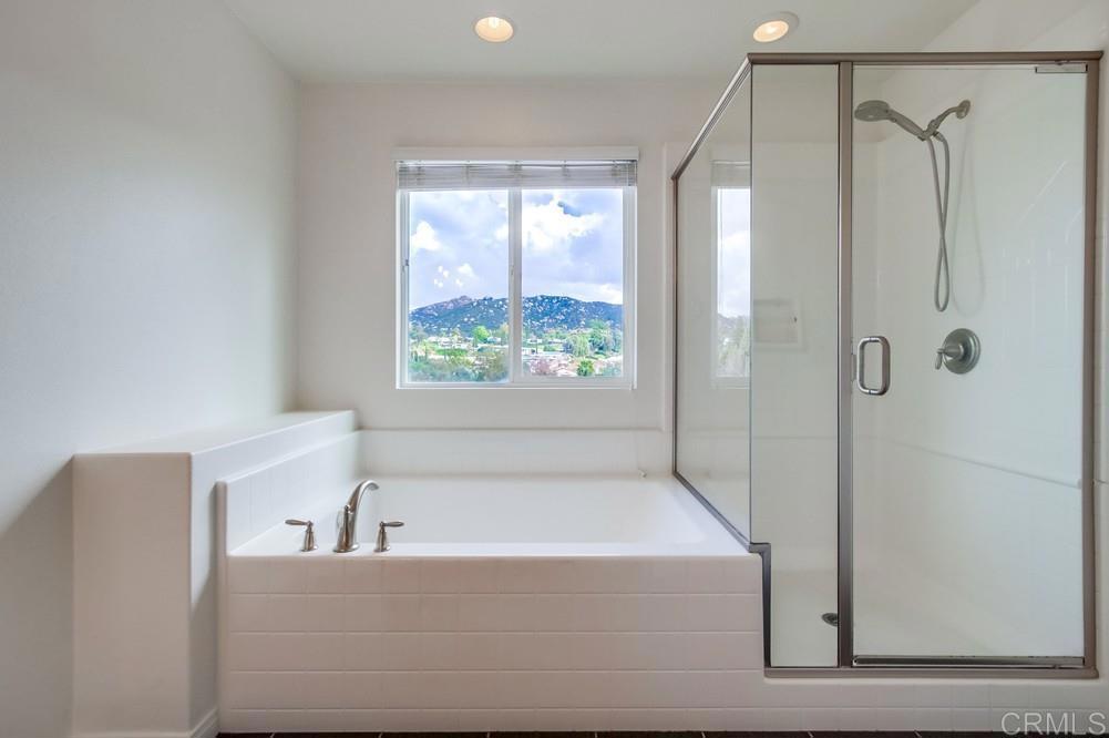 13109 Beacon View Lane El Cajon, CA 92021 - Photo 23 of 36 a bathroom with a bathtub and a shower