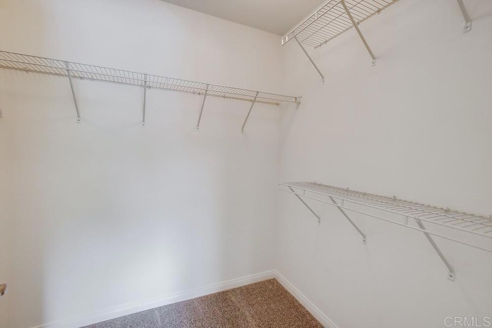 13109 Beacon View Lane El Cajon, CA 92021 - Photo 26 of 36 a view of a room with racks on the wall