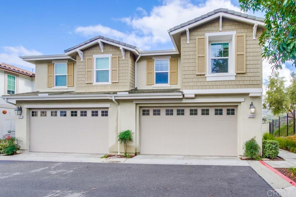 13109 Beacon View Lane El Cajon, CA 92021 - Photo 4 of 36 a front view of a house with a yard and garage