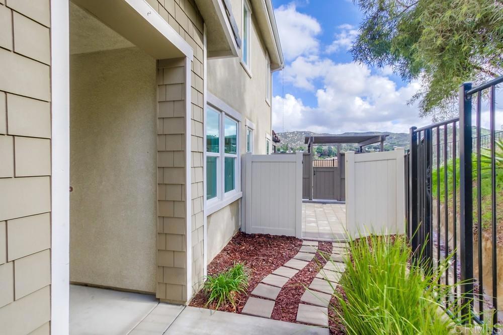 13109 Beacon View Lane El Cajon, CA 92021 - Photo 5 of 36 a view of a house with a yard