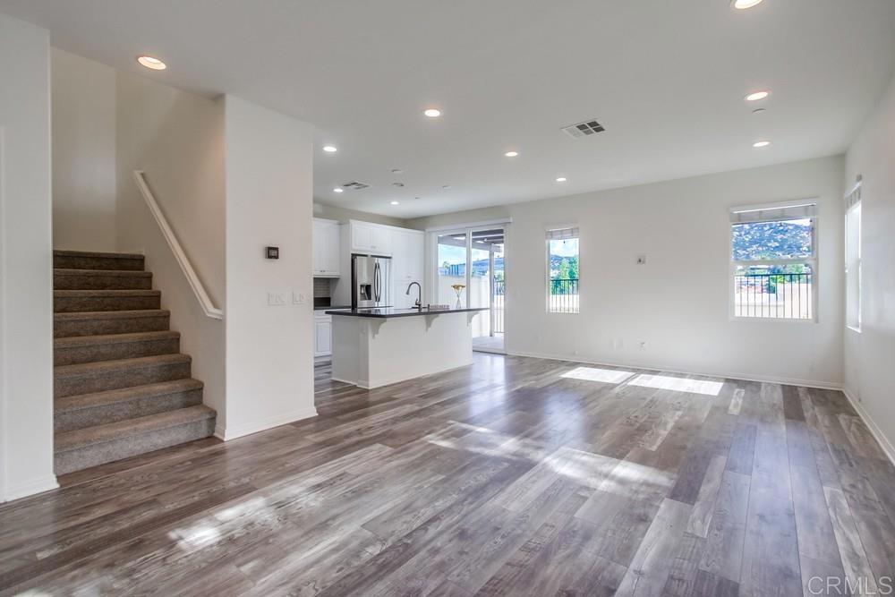 13109 Beacon View Lane El Cajon, CA 92021 - Photo 6 of 36 a view of kitchen and hall with wooden floor