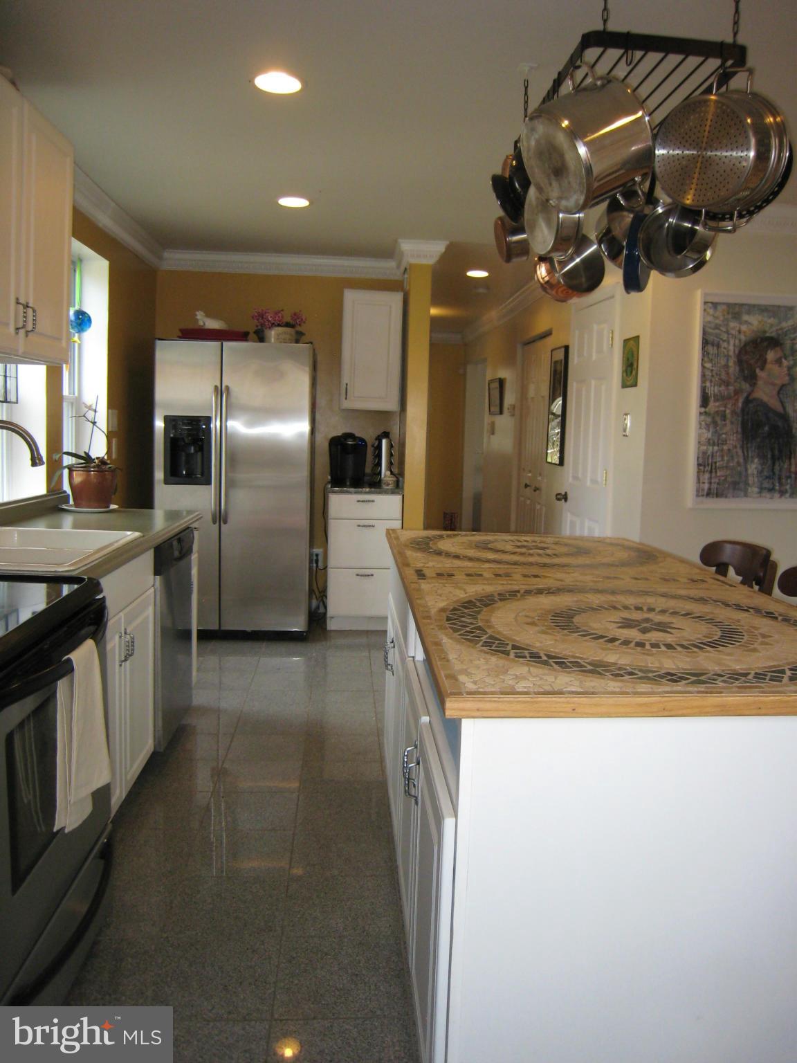 2826 Ridge Road Baltimore, MD 21244 - Photo 12 of 30 a kitchen with stainless steel appliances granite countertop a sink a stove and a refrigerator