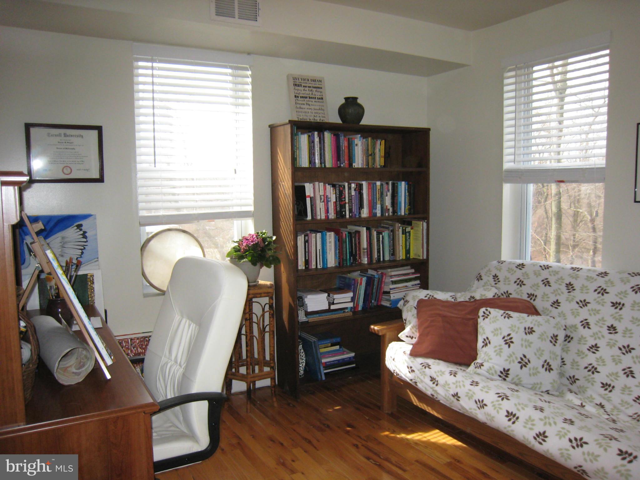 2826 Ridge Road Baltimore, MD 21244 - Photo 20 of 30 a view of a livingroom with furniture and a book shelf
