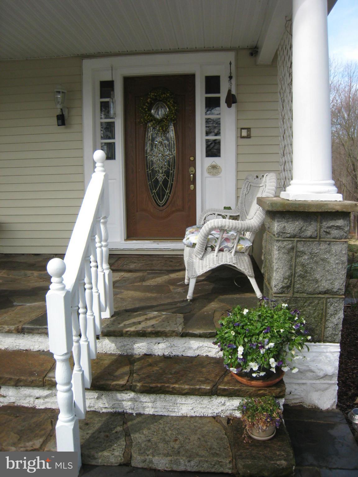 2826 Ridge Road Baltimore, MD 21244 - Photo 3 of 30 a front view of a house with entryway