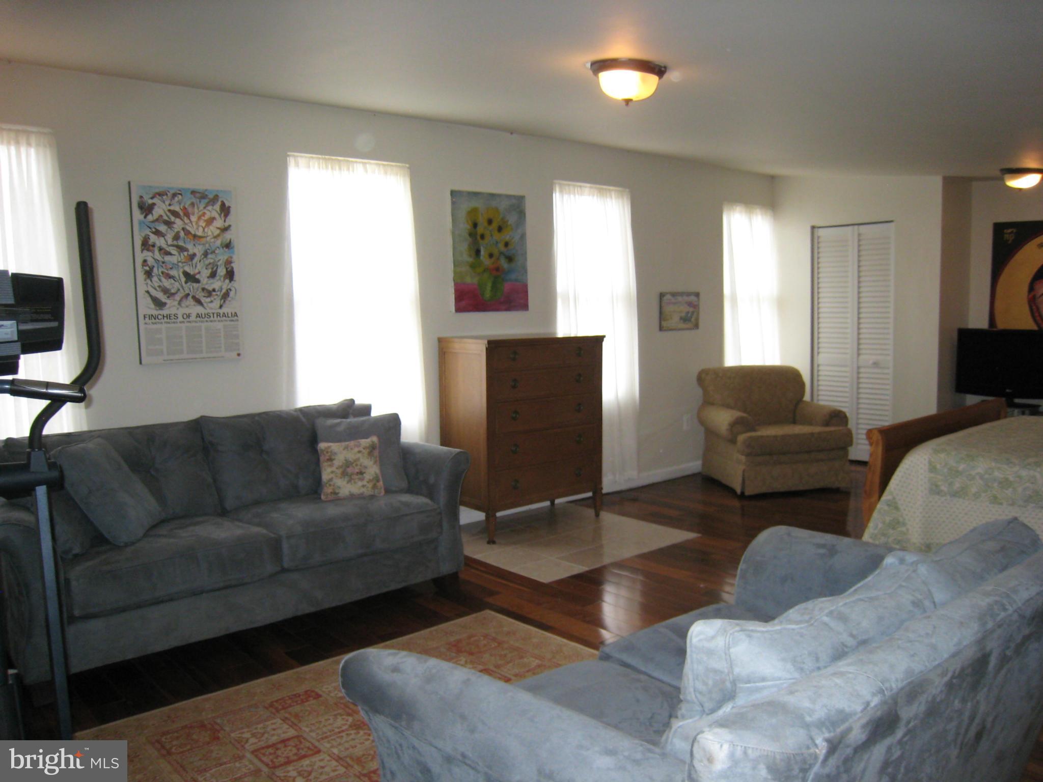 2826 Ridge Road Baltimore, MD 21244 - Photo 25 of 30 a living room with furniture and a flat screen tv