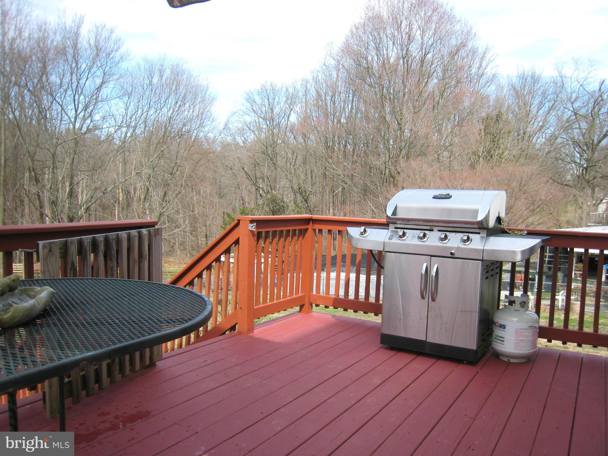 2826 Ridge Road Baltimore, MD 21244 - Photo 26 of 30 a view of a roof deck with wooden floor and fence