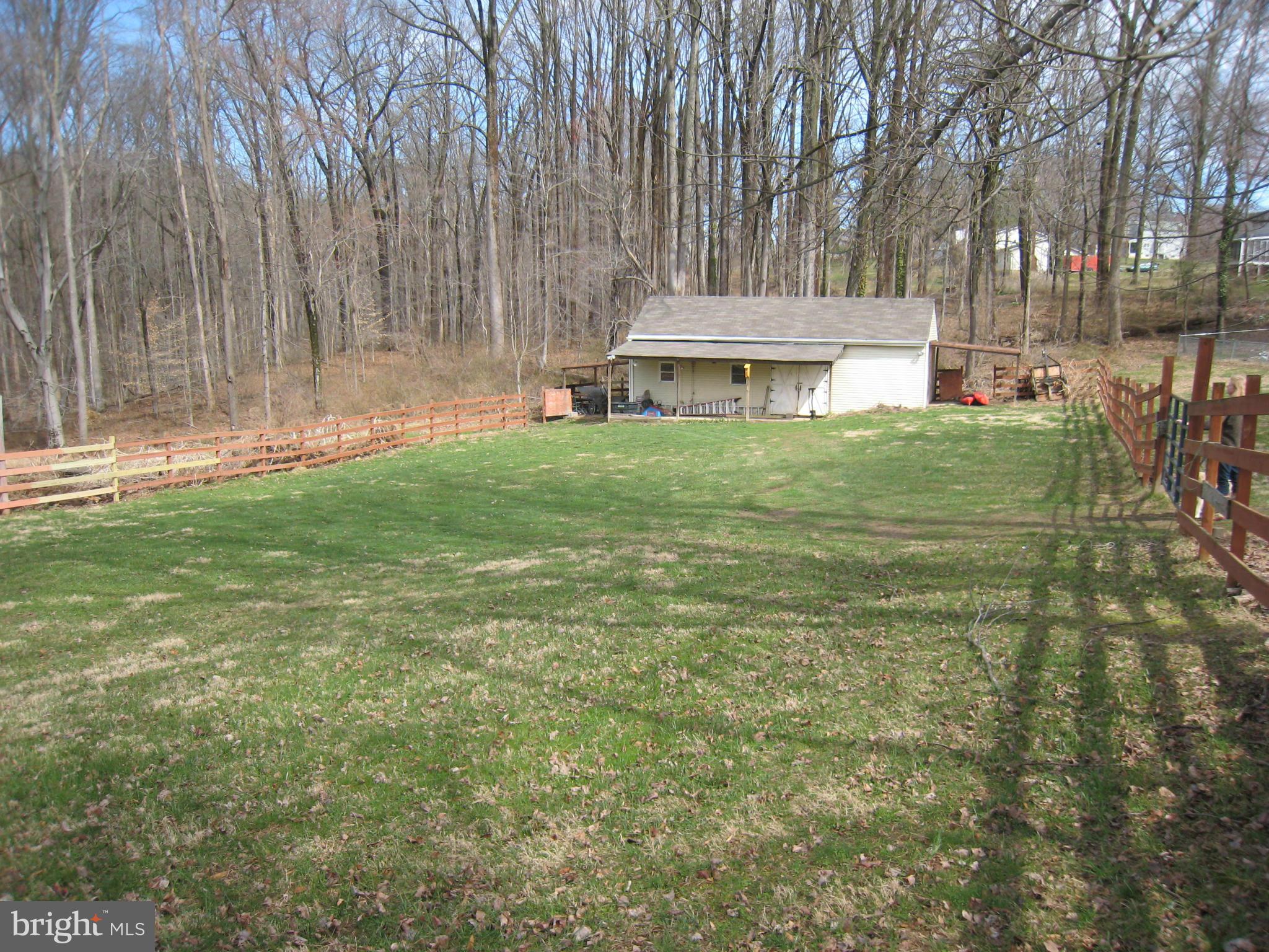 2826 Ridge Road Baltimore, MD 21244 - Photo 28 of 30 a front view of a house with a garden