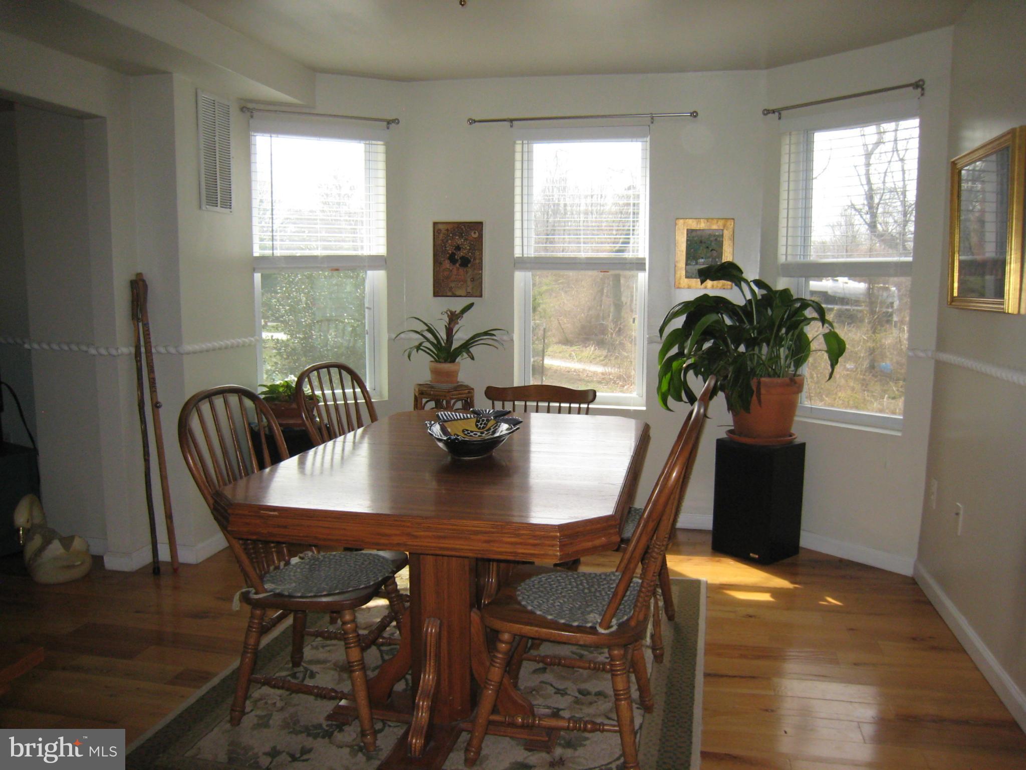 2826 Ridge Road Baltimore, MD 21244 - Photo 10 of 30 a view of a dining room with furniture and window