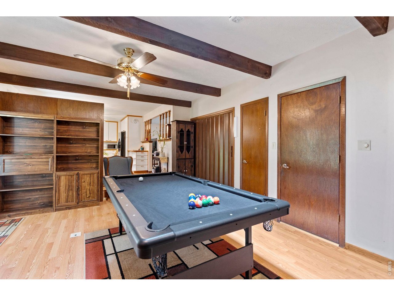 300 Ranch Acres Drive Loveland, CO 80538 - Photo 14 of 38 a view of a room with furniture and wooden floor