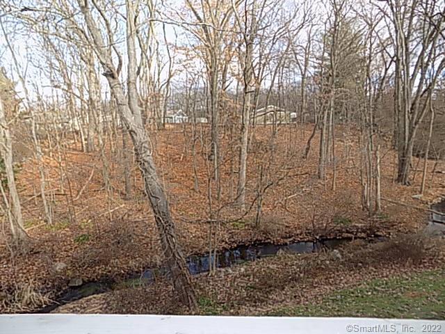 7 Padanaram Road, Unit J238 Danbury, CT 06811 - Photo 12 of 18 a view of house with yard