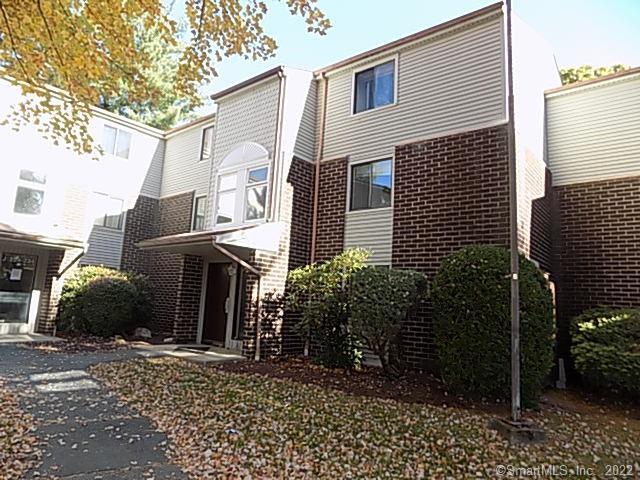 7 Padanaram Road, Unit J238 Danbury, CT 06811 - Photo 2 of 18 a front view of a house