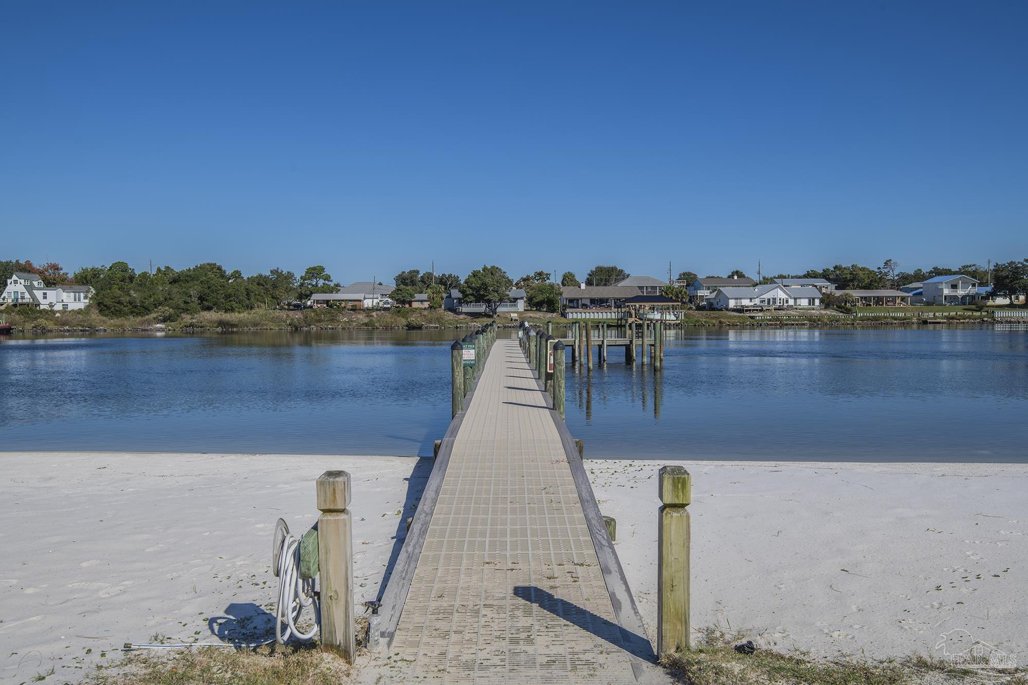 13928 River Road, Unit 504 Pensacola, FL 32507 - Photo 54 of 60 a view of a lake with a city