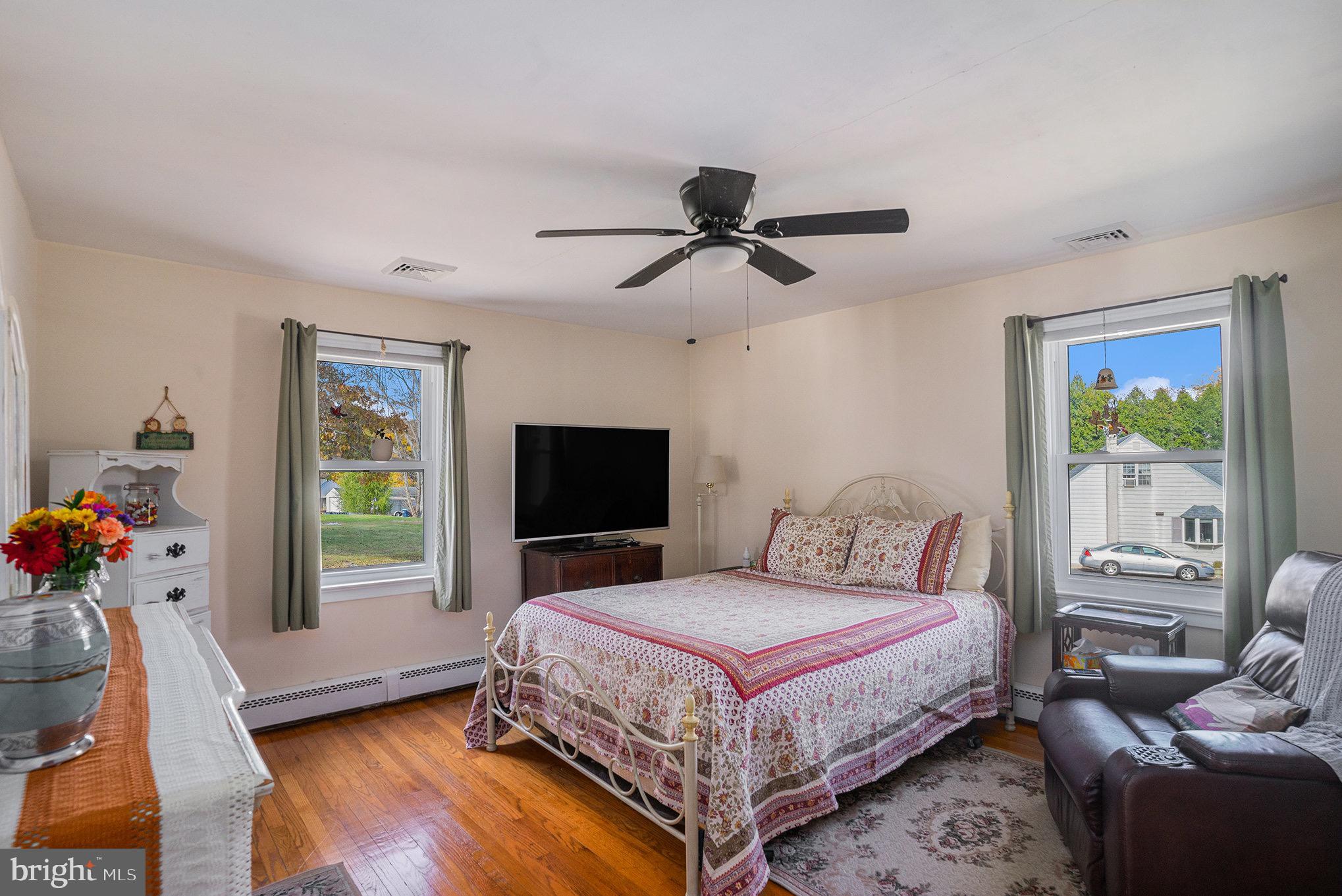 501 Walnut Street Green Lane, PA 18054 - Photo 11 of 28 a bedroom with a bed and a flat screen tv